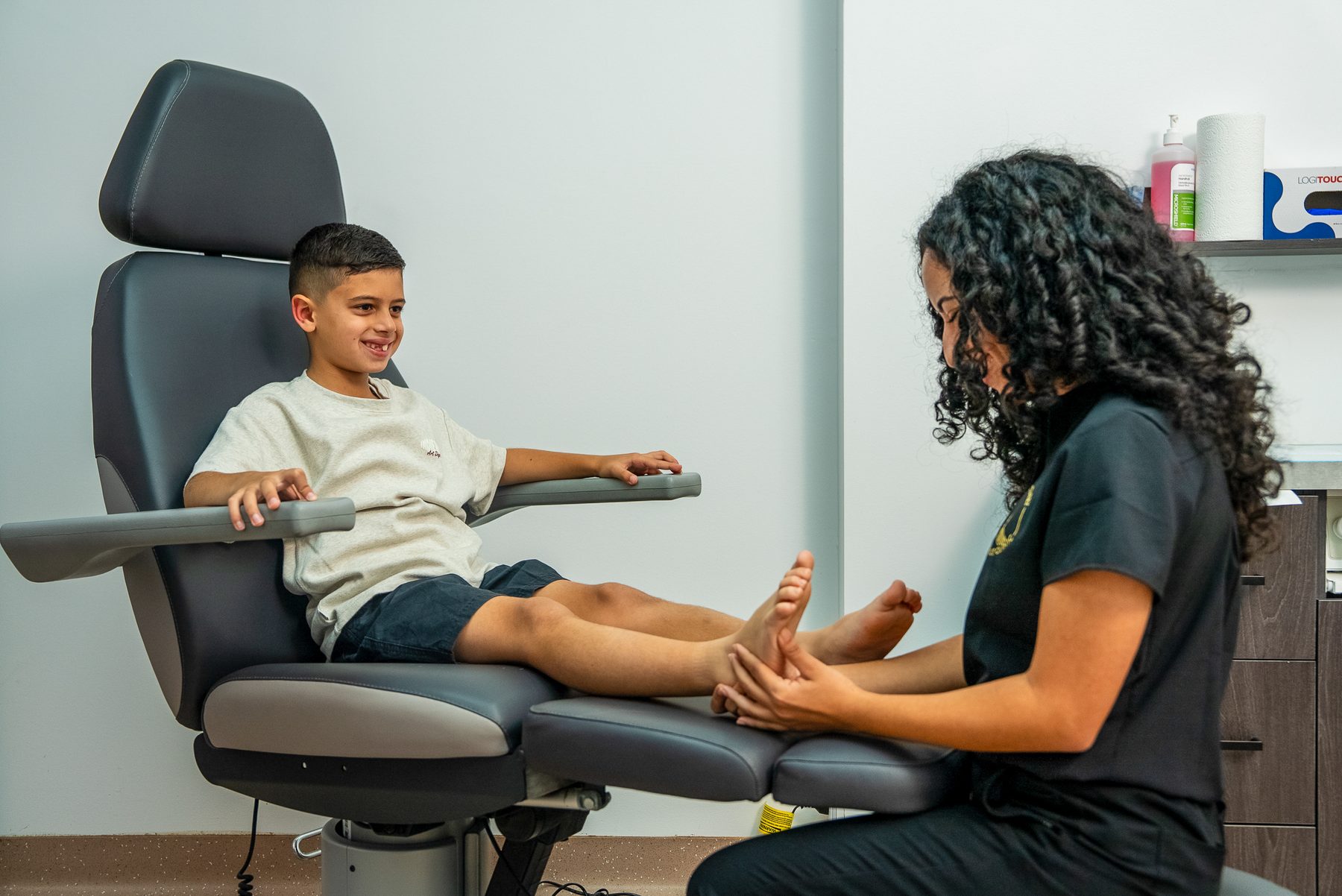 Bexley Podiatry clinician examining a child's foot in the clinic